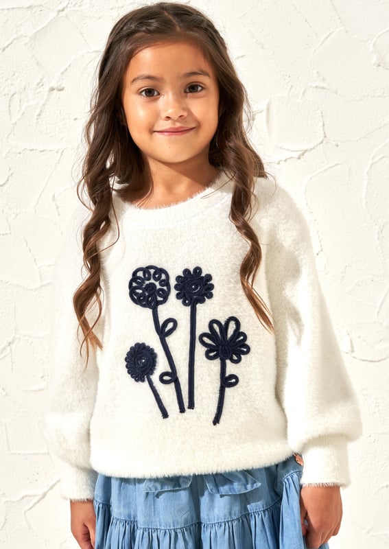 This jumper is like a giant stylish hug! Made from the softest fluffy yarn and adorned with a stylish cornelli bouquet it is the most perfect Spring knit.. About Me: 96% Nylon 4% Cotton Look After Me: Think Planet. Wash At 30C.