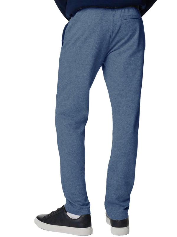 The Kruze Open Hem Joggers offer the perfect blend of comfort and functionality. Designed with an open hem for a laid-back look, these joggers feature a ribbed, elasticated waistband with adjustable drawstrings for a secure, customized fit. Practicality is ensured with two concealed side zip pockets and a single back zip welt pocket, providing secure storage for your essentials. Crafted with soft fleece lining, these joggers promise warmth and comfort, making them ideal for both lounging and casual outings
