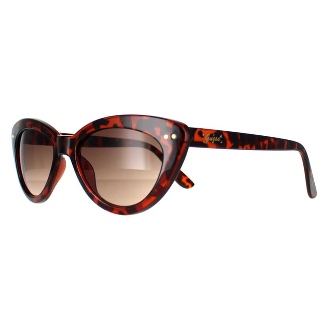 Guess Cat Eye Womens Gold Brown Gradient GF0402  Sunglasses are an alluring cat eye silhouette, adding a glamorous touch to any outfit. Crafted with meticulous precision, the lightweight yet durable frame, adorned with the iconic Guess logo on the temples, embodies a mark of refined taste and quality. Not just a fashion statement, these sunglasses prioritize eye protection, featuring high-quality lenses that offer excellent protection, ensuring both style and safety.