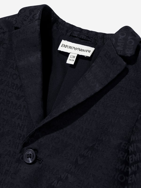 Unveil timeless elegance with the Emporio Armani Baby Boys Logo Blazer in Navy, tailored perfectly for AW2024. Crafted for style and comfort, this piece is an essential for a young gentleman's wardrobe. Key features include: Iconic Emporio Armani logo detailing adds a luxe touch. Premium fabric ensures durability and all-day comfort. Versatile design complements both formal events and casual outings. Navy hue provides a classic, sophisticated look.Elevate your boy's fashion ensemble with this exquisite blazer. Perfect for making a stylish statement!