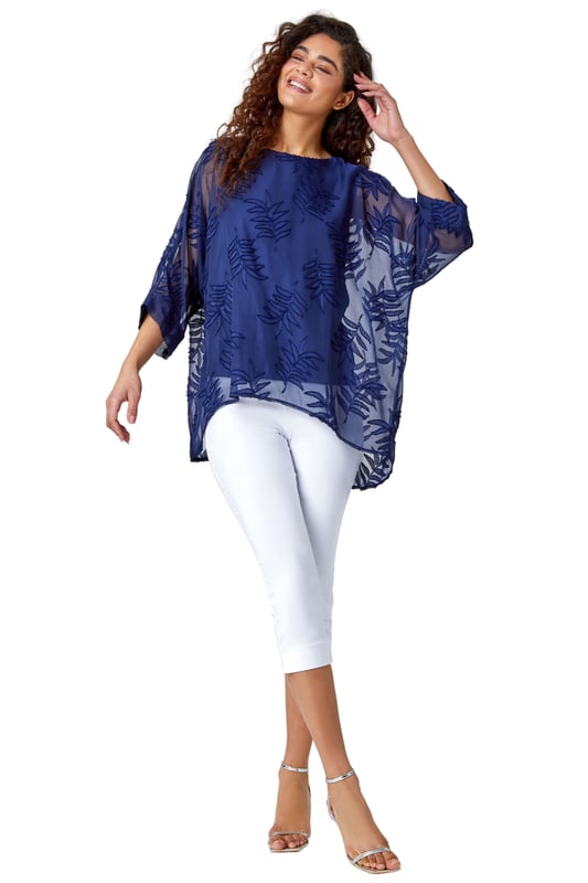 Leaf Burnout Print Chiffon Overlay Top from Roman. Dare to reveal all? Well this stunning mesh leaf embossed top is perfect for those evenings out. Featuring a round neckline with 3/4 length batwing sleeves, finished with a longer back hem and a silky cami top lining underneath for that added extra glam. Opt for faux leather leggings and heels for date night or alternatively some cropped trousers and wedges for your holiday night out.