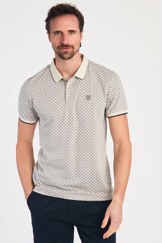 This textured cotton polo shirt from Kensington Eastside blends classic sophistication with modern design. Crafted from a premium fabric with a subtle pattern, it offers a refined yet contemporary look. Lightweight and breathable, it’s a versatile choice for smart-casual occasions, ensuring style and comfort effortlessly.