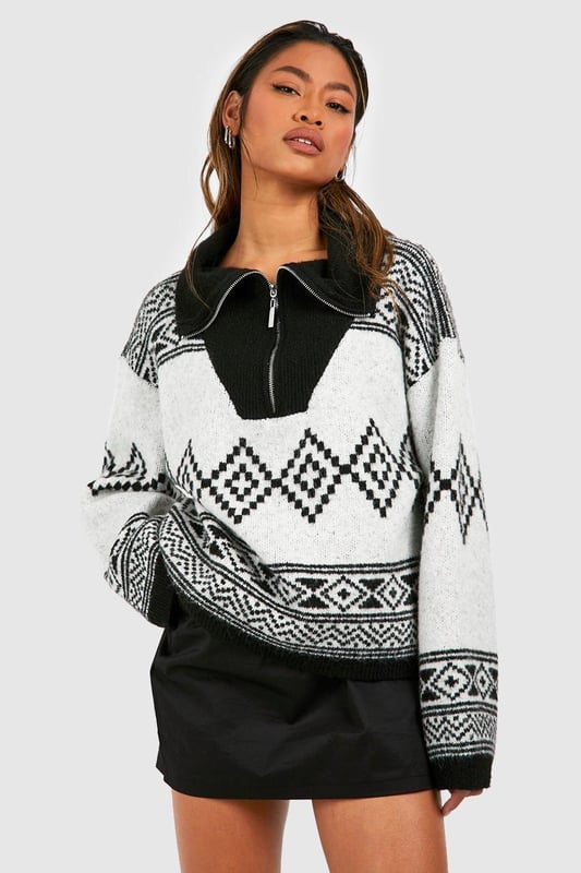 It's the season to feel snug and what better way than with this oversized jumper. Bigger than your usual size which elongates your silhouette, our women's oversized jumpers are cosy and comfortable for your autumn and winter wardrobe. Perfect for whatever plans you've got coming up, make a satin slip dress a little more casual with an oversized rib knit thrown on and banish those winter blues by stepping into a cable knit baggy jumper over leggings and ribbed socks. Warm and cosy is the vibe this season.Style: Oversized JumperNeckline: Zip FunnelSleeve Length: Long Sleeve