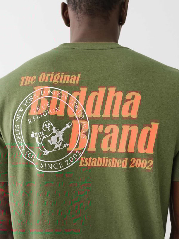 Elevate your everyday look with the Buddha Stamp Crew Tee. Crafted from soft cotton knit, this T-shirt features a crew neck, short sleeves, and stamp graphic with a Buddha logo in the center. Finished with a back “The Original Buddha Brand” tex
