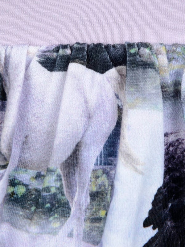 Molo project fun Scandinavian properties and stellar sustainability into their eccentric abstracts.¬†These baby girls oriental peacock leggings are a captivating piece. Made in luxurious high quality. They showcase Pegasus and unicorn imagery as an all-over pattern to project the idea of movement.  Cotton