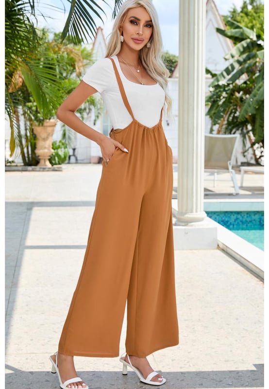 High Rise Wide Leg Suspender Pants
  Quality materials
  Flattering high-rise waist
  Sophisticated wide leg design
  Unique and trendy suspenders
  Versatile for any occasion
  Elevate your fashion game