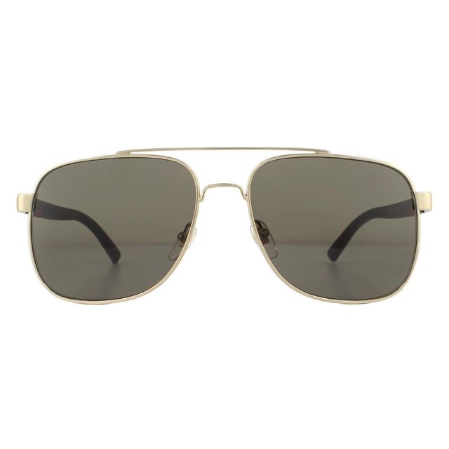 Gucci Sunglasses GG0422S 003 Gold Brownare a sophisticated square aviator design. The metal frame front features a double bridge and adjustable nose pads for a comfy fit. Rubberised temples showcase the brand's text logo as well as their signature green and red stripe..