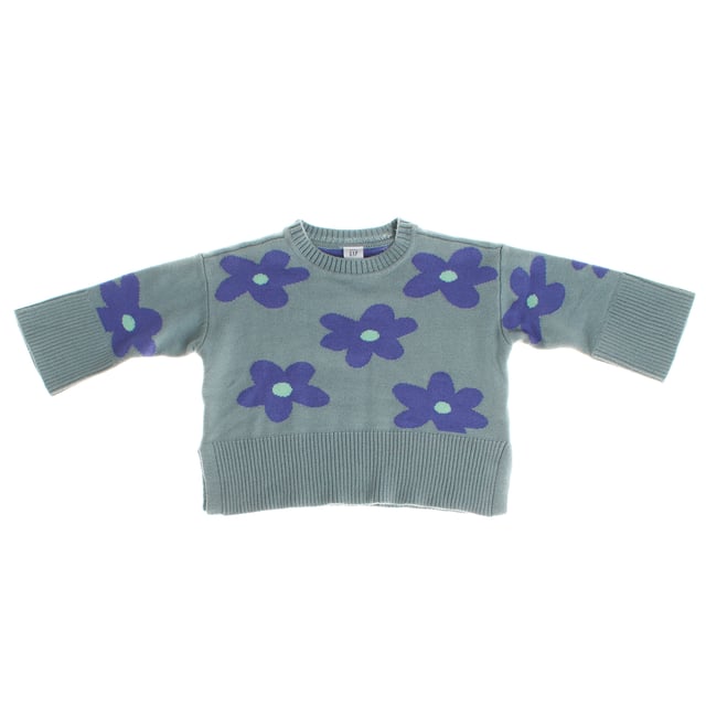Girls' jumper made from a soft and comfortable fabric, ideal for keeping warm on cool days.

 It features a crew neck design and a slightly loose fit, allowing for greater freedom of movement.

 The sweater is decorated with a striking floral design, adding a fun and cheerful touch to the style.

 Ribbed cuffs and hem add texture, while side slits at the hem add modern detail and encourage movement.

 This sweater is perfect for combining with different casual outfits and adding a touch of color to little ones' wardrobe.
 Composition: 100% Cotton
 Care:
- Machine wash cold.
 - Use mild detergents.
 - Do not use a dryer.
 - Iron at low temperature.
 - Do not dry clean.