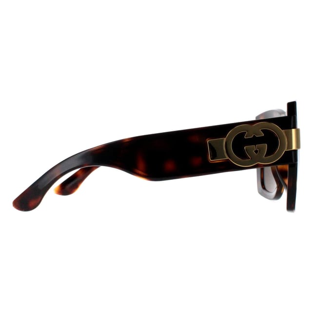 Gucci Square Womens Dark Havana with Gold Brown GG1688S  Sunglasses offer a perfect combination of modern sophistication and understated luxury. With their bold, square frame, these sunglasses make a striking fashion statement while maintaining a timeless appeal suitable for various occasions. The design is complemented by Gucciâ€™s signature double-G logo on the temples, adding a touch of iconic branding that speaks to the wearerâ€™s impeccable taste. High-quality lenses provide essential UV protection, ensuring comfort and safety without compromising on elegance.
