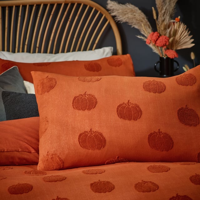 When the nights are drawing in and the weather is turning, why not add this warming duvet cover set, which is a pared back autumnal take on Halloween. Adorned with soft tufts of cotton in the shape of pumpkins and surrounded by a spiced orange 100% cotton fabric. This design adds a pop of colour to your bedroom, providing an elegant alternative to traditional Halloween décor.