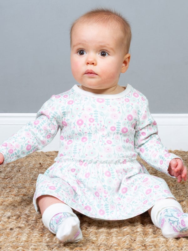 Practically perfect! The pretty daisy ditsy design brings together style with easy dressing in one garment. A combined bodysuit and dress gives a great look with lots of comfort and is oh-so-practical for adventurous little ones on the go.