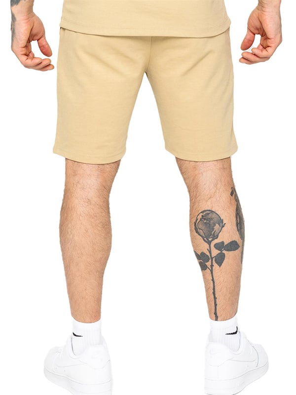 Enzo Mens Casual Stretch Shorts offer comfort and convenience with 2 side & 2 back pockets, elastic waistband & adjustable drawstring, and front pin tuck seam detail for added style and functionality. Perfect for errands or lounging with a practical and stylish design.