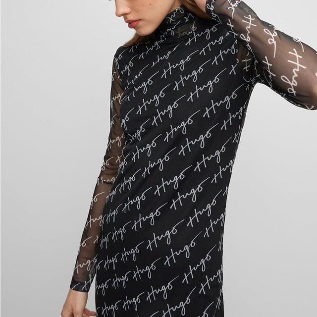 Womens HUGO Neshy Dress in multi colour.- Turtleneck.- Long sleeves.- Topstitched hem-edge.- Semi transparent with opaque underdress.- All-over script print.- Fitted design.- Midi length.- Main material: 92% Polyester  8% Elastane.  Lining: 90% Polyester  10% Elastane.  Machine washable.- Ref: 50489186961