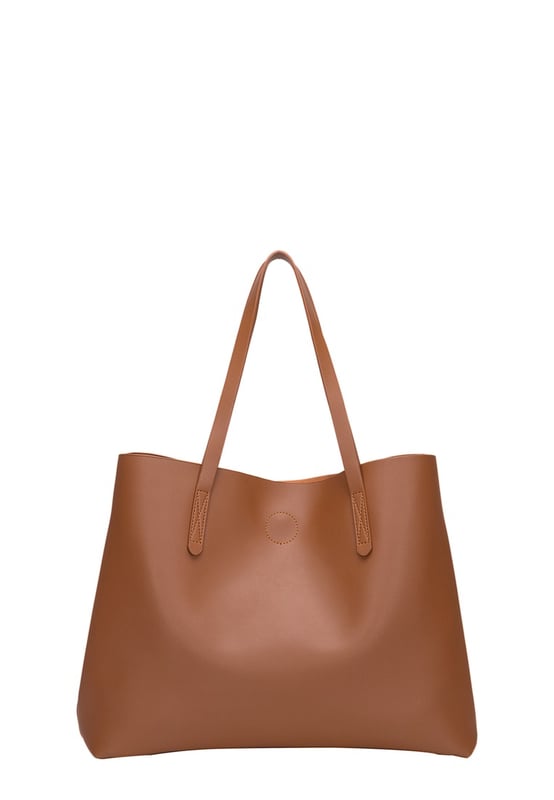 Let simplicity be key with the ophelia tote bag, perfect for taking your look through the week. In a range of colours this tote is made from unlined pu making it lightweight and spacious. With simple design features such as the claudia canova debossed logo, this bag is perfect for everyday sleek style. The bag fastens with a mag-dot clasp and inside reveals an inner pouch with a zip fastening to keep all your daily essentials safe. Features: , unlined pu, claudia canova debossed logo, mag-dot clasp fastening, twin grab handles, soft and flexible shape, removable inner pouch with zip fastening