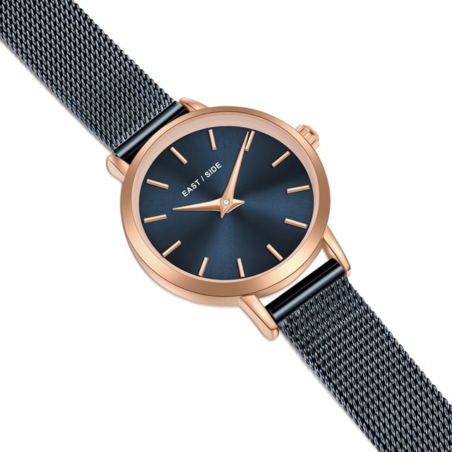 GENERAL INFORMATION:  • Targetgroup: Female  • Wristwatch: No Special Functions  • Display: analogue  • Weight of watch w/o box (gr.) - approx.: 24,0  MOVEMENT:  • Movement: Quartz  • Term of Movement: VC10  • Origin of movement: Japan  BRACELET:  • Material of bracelet/strap: Stainless steel  • Plating of bracelet/strap: Ion-Plating (IP)  • Finishing of bracelet/strap: Smooth  • Finishing/Decoration of bracelet/strap: None  • Clasp/Closure/Buckle: Slide Clasp  • Color of bracelet/strap: Blue  • Length of bracelet/strap (mm) approx.: 190,0  • Width of bracelet/strap (mm) approx.: 9,5  • Style/Design of bracelet/strap: Mesh band (Millanaise Style)  • Bracelet/strap adjustable?: No  CASE:  • Shape of case: Round  • Size/Diameter of case in mm . approx.: 24,0  • Height of case in mm: 7,6  • Case material: Metal (Alloy)  • Surface of case: Polished  • Bezel/Topring: Fixed  • Finishing/Decoration of case: None  • Material of case back: Stainless steel  • Lock of case back: No screwed-in crown  • Color of case: Rosegold  • Coating/Plating (Case): Ion-Plating (IP)  • Type/Form of crystal: Flat  • Material of crystal: Mineral crystal  • Water resistant (ATM): 3  DIAL:  • Size jewelry care cloth: Hour, Minute  • Indices: Line indices  • Material of dial: Brass  • Structure/pattern of dial: Flat  • Color of dial: Blue  PUSHER, CROWN, HAND:  • Pusher: None  • Corrector: No  • Crown: No screwed-in crown  • Type of hands: Dauphine hands  • Luminescent (hands): No  PACKAGING & SCOPE OF DELIVERY:  • Box: Yes  • Service booklet: Yes  • Manual: Yes
