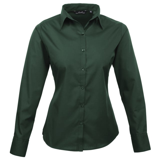 Womens easy care long sleeve blouse. Soft collar styling. Rounded bottom hem. Fitted styling with bust and back darts. Pearlised buttons on white shirt, self colour buttons on black. Double buttons on cuff. Size 6*, 8, 10, 12, 14, 16, 18, 20, 22, 24, 26 * size 6 only available in black and white. Bust: 6 - 35.5”, 8 - 37.5”, 10 - 39.5”, 12 - 41.5”, 14 - 43.5”, 16 - 45.5” 18 - 47.5”, 20 - 49.5”, 22 - 51.5”, 24 - 53.5”, 26 - 55.5”. Fabric 65% Polyester, 35% Cotton. Plain Poplin Weave Weight 105gsm