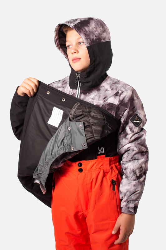 The Breaker snow overhead jacket stands out from the crowd and is our premium youth overhead jacket styled for maximum impact. The Breaker has fully taped seams and is highly waterproof to 10,000mm with a breathability rating of 10,000gms/M2 this technical snow jacket will make sure you’ll stay warm and dry. The Breaker jacket is made from our durable coated ripstop fabric and is feature packed. This jacket offers a great bang for your buck with under arm ventilation for when you need to dump heat, a powder skirt with Lycra wrist guards to keep the snow out and warmth in. A dry butt patch, to do exactly that, lift pass pocket on the left sleeve, soft chin guard, internal storm flap, zipped handwarmer pockets and a zipped comms pocket with headphone routing system all complete this street wear inspired piece.

Powder skirt - Whether you’re hitting the powder on skis or snowboard, this snow skirt creates a tight seal around your waist to keep the snow out and the warmth in. Made from durable waterproof materials and an internal dry butt patch (DBP) to keep it all warm and dry.

Snow cuff / wrist gaiter - This is perfect for even the most extreme conditions, featuring a tight seal that bridges the gap between your glove and jacket.

Zipped pockets - Pockets designed for everything you need for a full day up the mountain. Pockets for your lift pass, media, stash pocket for cash, wallet pocket and phone pocket for protection and to keep the battery warm.

Design features:

    Taped seams
    Fixed hood
    Super soft chin guard
    Zipped sleeve ski pass pocket
    Snow cuffs
    Twin zipped tricot lined hand warmer pockets
    Waterproof snow skirt
    Dry butt patch ( DBP )

Fabric & performance:

    Regular fit
    Shell 100% polyester
    Water resistant coating 10,000mm
    Breathbility rating MVP 10,000 gm²

Insulation & lining:

    100% recycled polyester low loft insulation.
    Insulation. 80 gm² body 40 gm² Sleeves
    Lining 100% recycled embossed polyester.