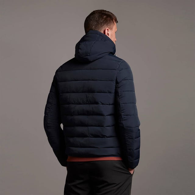 Stay protected from the elements with the Lyle & Scott lightweight puffer jacket. Made from highly durable and soft polyester, and featuring an adjustable hood, this lighter regular-fit puffer jacket is the perfect transitional jacket for navigating any weather.