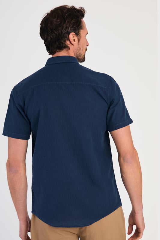 Blue Linen Blend Short Sleeve Button-Up Shirt With Chest Pocket Upgrade your summer wardrobe with this short-sleeved, linen shirt from Tokyo Laundry. Made from a breathable blend of linen and cotton, this shirt offers comfort and style with its classic fit. The shirt features button fastening and a chest pocket. Machine washable for easy care.