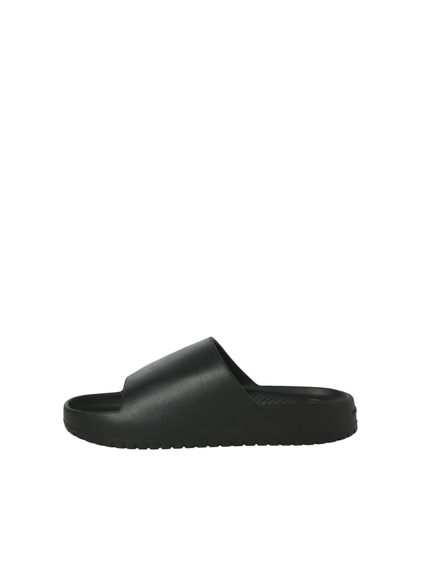 Jack & Jones schoenen Deze Jack & Jones loafers combineren een casual design met maximaal comfort - perfect om elke dag te dragen! Dankzij het ontwerp met open teen en de eenvoudige effen kleur kunnen ze op verschillende manieren worden gecombineerd en zijn ze geschikt voor elke gelegenheid. De schoenen kunnen snel en moeiteloos aan- en uitgetrokken worden zonder vervelende sluitingen, waardoor ze de ideale metgezel zijn voor ontspannen dagen. De hoogwaardige afwerking maakt ze comfortabel om te dragen, terwijl het lichtgewicht materiaal zorgt voor een luchtig gevoel. Of je nu thuis bent, door de stad slentert of op vakantie gaat - deze slip-on schoenen bieden comfort en stijl in één!