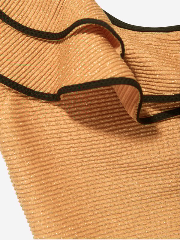 Nessi Byrd embody modern properties in their beautiful luxury resortwear. This girls Eliza swimsuit is reflective of the New York label's passion for vibrant aesthetics with an innovative twist. Crafted in a one-shoulder design with elegant ruffle detailing via a special glittered effect.Elasticated 80% Polyamide 20% Elastane