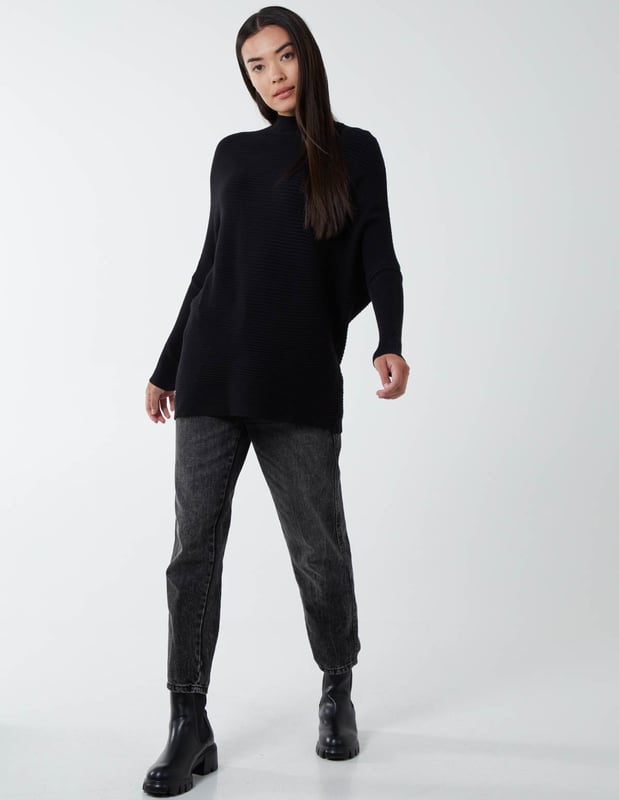 What do we want in Winter? We want to be warm, comfortable and yes€¦ the best we can look anywhere we go. Which why our highly elasticated batwing jumper with a high neckline is a close friend of ours. It's here when we go to work, a casual weekend, or a night out. And it puts us in a particularly good mood when styled with a pleated skirt and high knee boots.