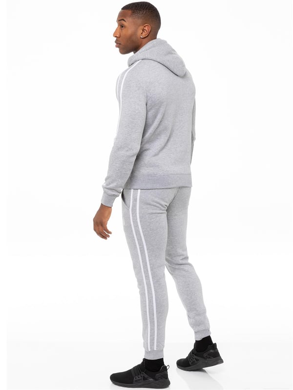 Enzo Mens Tape Hoodie Full Zip Tracksuit. Zip Through Hooded Top. Enzo Embroidery Logo on Chest and Contrast Stripe Design on Sleeves. Hoodie with Drawstring. Ribbed Waist and Cuffs. Kangaroo Pockets. Enzo Mens Casual Designer Striped Tracksuit Joggers. Featuring Classic Contrast Stripes to Sides. 2 Side Pockets. Cotton Blend for Superior Comfort. Adjustable Waist with Drawstrings. Athleisure Perfect for All Gym wear