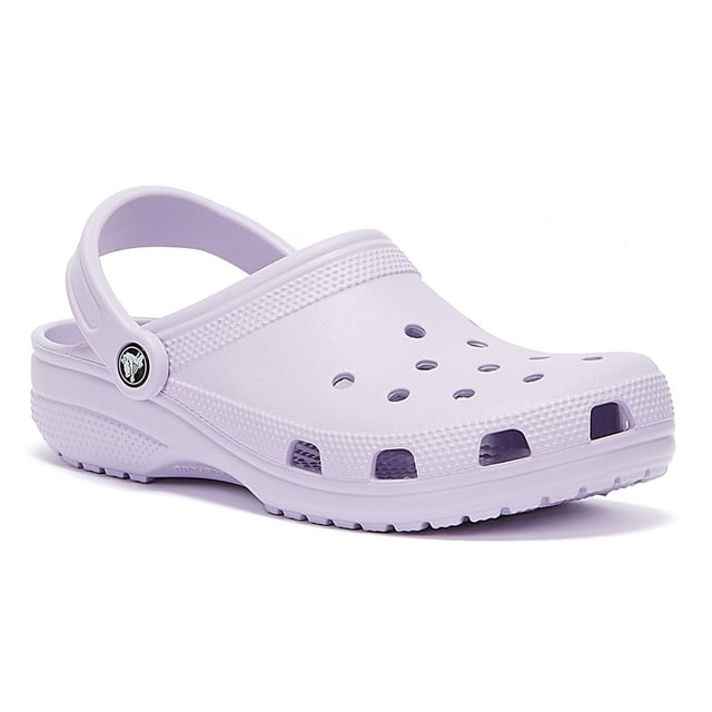 Womens Crocs Classic Clogs in lavender.- Slip on fastening.- Pivoting heel straps.- Ventilation ports add breathability and help water and debris drain away.- Croslite™ footbed.- Lightweight  non-marking soles.- Ref: 10001530L