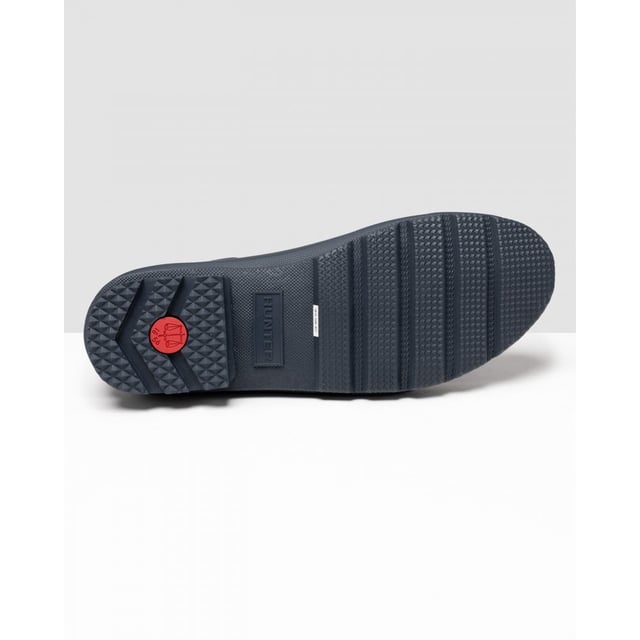 Size/Fit Summary: True to size, Regular fit which features new engineered improvements. If you are in-between sizes or want to wear a thick sock, it is recommended to size up.
The Hunter Original Chelsea Boot has been re-engineered for an improved fit and all-day comfort. A wider ankle circumference, and an increased curve in the heel and around the Achilles tendon delivers an even more comfortable fit.
The new and improved Hunter Original Chelsea Boot has an even more optimum fit to maximise all-day comfort. Ready for rain, each boot is handcrafted from natural rubber and vulcanised for superior protection. Retaining the iconic features of a traditional Chelsea, it features elasticated-gussets and has a nylon pull-tab to make stepping into the boot easy. In a classic black matte, these men's waterproof Chelsea's are a wet weather wardrobe essential.
We recommend that all Hunter Chelsea boots be worn with Hunter Chelsea socks, which have been technically designed to protect the wearer's skin from contact with rubber in specific areas.

Waterproof
Handcrafted
Waterproof
Polyester lining
Rubber outsole with Hunter Original tread pattern
Elastic side gussets and nylon pull-tab
Crafted from natural vulcanised rubber with a matte finish