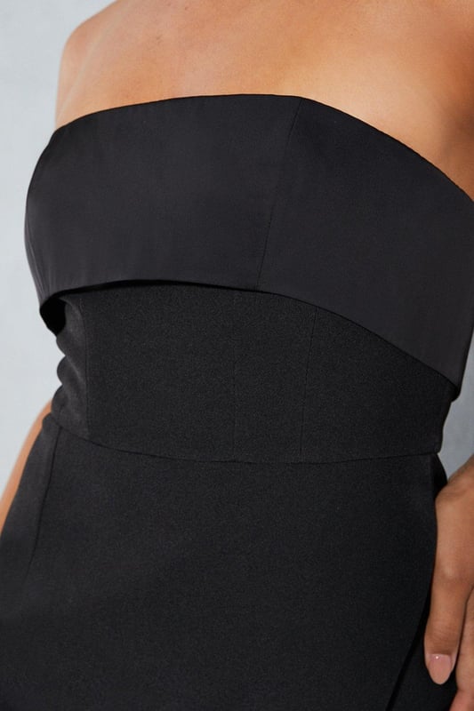 Strapless bandeau neckline for a sultry look
Corset-style bodice with structured boning
Skort design with shorts underlayer
Fold-over detailing at the waist
Stretch woven fabric for a flattering fit

Exude confidence in this eye-catching playsuit from Misspap. The strapless bandeau neckline and corset-style bodice with structured boning create a figure-flattering silhouette, while the skort design with shorts underlayer offers a playful twist. The fold-over detailing at the waist adds a touch of sophistication. Style with strappy heels and statement jewellery for a night out with friends or a glamorous evening event.