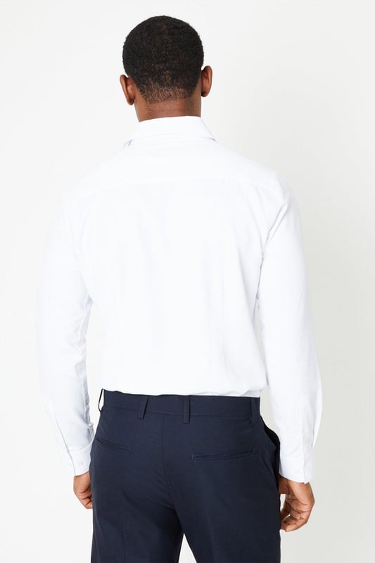 Slim fit shirt tailored for a sharp silhouette
cavalry twill fabric for a smart look
Easy iron finish for effortless maintenance
Spread collar for a refined appearance
Long sleeves with buttoned cuffs

Exuding sophistication, this slim fit shirt from Burton is a versatile choice for smart casual occasions. The cavalry twill fabric and easy iron finish ensure a polished look with minimal upkeep. Pair it with chinos or tailored trousers for a refined yet relaxed ensemble, perfect for after-work drinks or weekend brunches with friends. The spread collar and buttoned cuffs add a touch of elegance, making it an ideal option for more formal events as well.