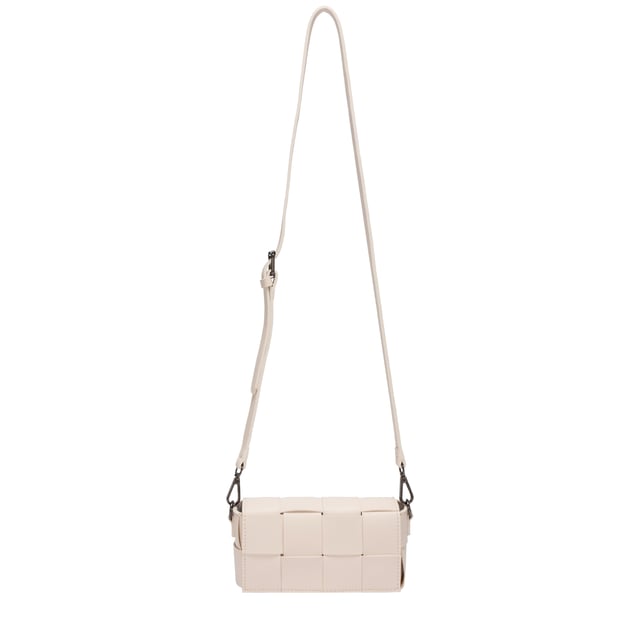 *Bags* of potential This Lana cross body features intricate cut-outs and woven detailing for a sophisticated stylish look. Magnetic fastening is secured with the fold-over flap top. Detachable and adjustable strap means you can wear this as a cross-body or as a clutch.