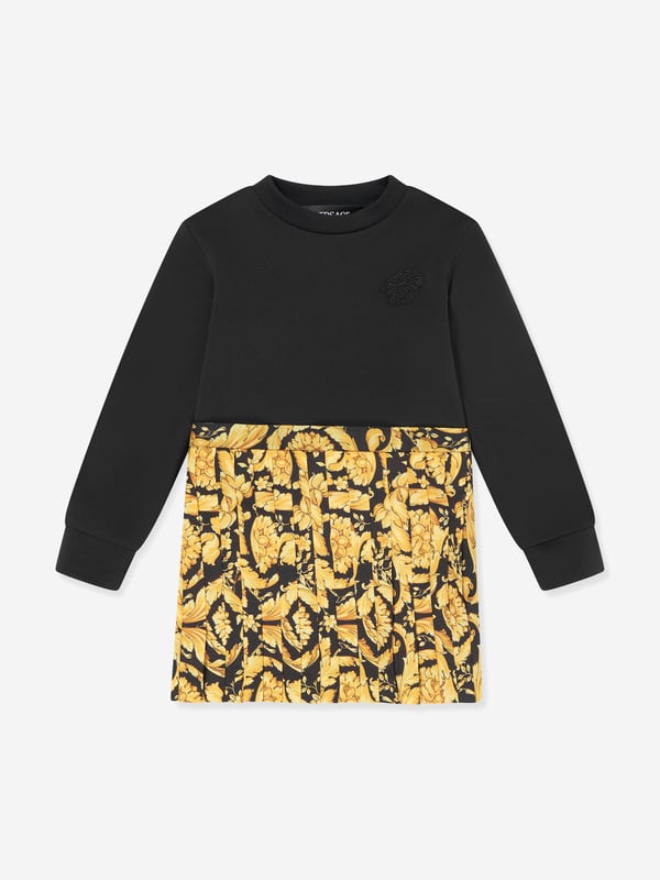 Versace envision bold, innovative abstracts in their beautifully haute couture abstracts. This baby girls black sweater dress encapsulates the Italian label's passion for daring and unparalleled technology. Envisioned in soft, stretchable knit fabric via a yellow and black striking baroque motif. It showcases an embroidered logo on the left wrist with a satin skirt that has a slight ruching/pleating effect. ‚ Long Sleeves‚ Round Neckline‚ Black Embroidery ‚ 100% Cotton