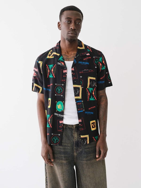Grab your luggage and head to somewhere tropical in the Resort Print Camp Collar Shirt. Crafted from a soft woven fabrication, this men’s shirt features an allover conversational resort print, camp collar, short sleeves, and button-front closures.