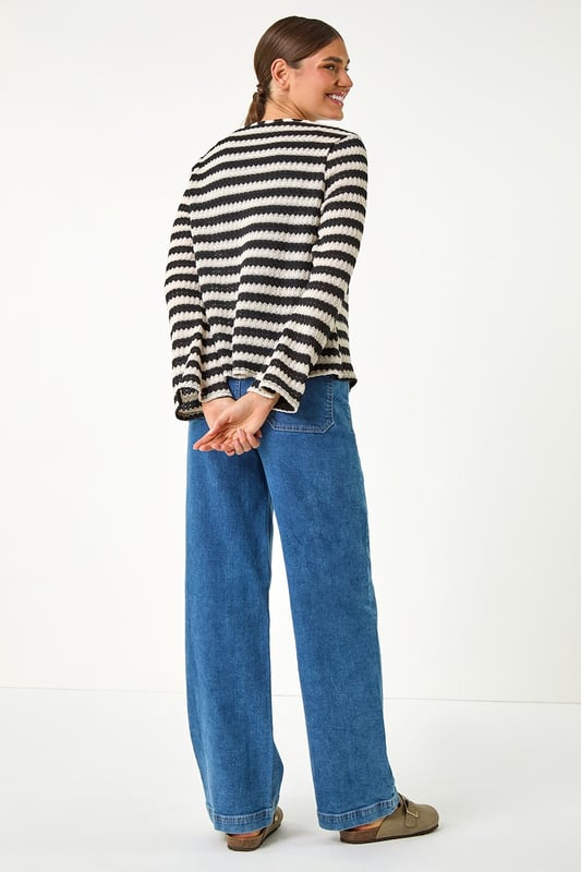Striped Print Tie Detail Cardigan from Roman. Stay warm and stylish this Autumn with our stripe print cardigan. Crafted from a cosy pointelle knit fabric, this cardi features a trendy tie front fastening, perfect for layering on those cooler days. The hip-length design and long sleeves ensure a comfortable and flattering fit. Pair with jeans and ankle boots for a chic and effortless daytime style.
