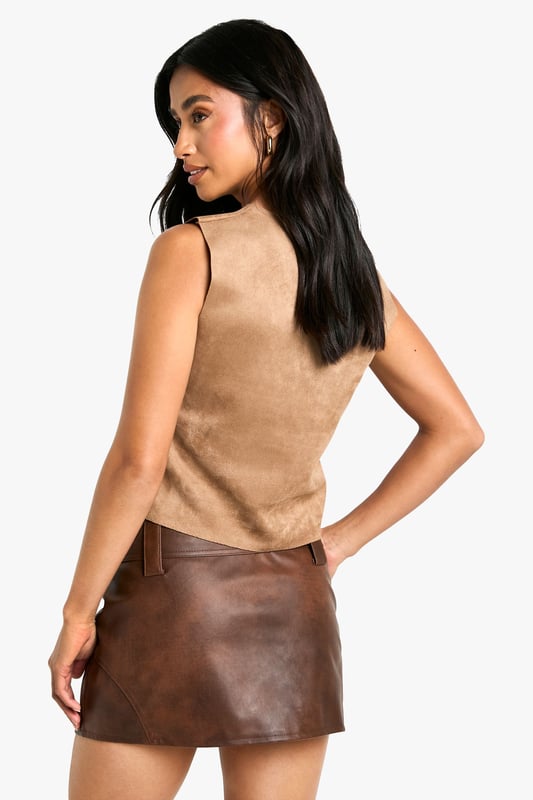 Petite Faux Suede Racer Top Gain some serious style points this season in our petite tops. Cut shorter to ensure the perfect fit, our tops for petite women are designed for queens 5'3'' and below. From petite t-shirts to women's petite blouses, we've got all the new-season styles you need in your wardrobe. Feeling casual? Dress it down with your fave pair of denim jeans and a leather. If out out is more your vibe, team with some leather trousers and high heels to make a statement!Style: TopFabric: Faux Suede