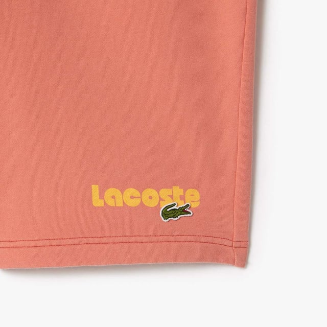 Washed Effect Lacoste Print Jogger Shorts Organic cotton fleece Regular fit  straight cut  Drawstring waist Contrast Lacoste print Embroidered crocodile on front Washed Effect Lacoste Print Jogger Shorts Organic cotton fleece Regular fit  straight cut  Drawstring waist Contrast Lacoste print Embroidered crocodile on front