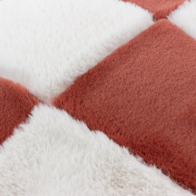 You will never feel anything as soft as the Cozee Check cushion! This oversized trending checkerboard pattern is made from the most snuggly faux fur and is just as good on the reverse too! Available in a range of joyful colours, this design will sit perfectly in any modern home.
