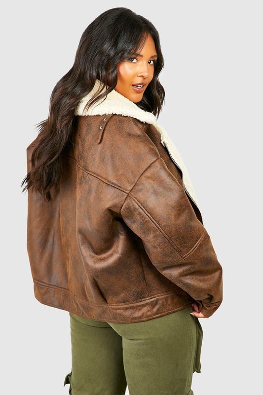 Take your outfit to new style heights with an aviator jacket. Perfect for layering, create a stylish oversized silhouette as you choose from crop belted jackets to faux fur lined options. A cross between a classic flight jacket and a leather biker, it's all about the detailing with this snug winter staple. Pair your aviator coat with high waisted mom jeans and a fierce attitude as you stroll your way through your social calendar.Style: Aviator JacketFabric: WovenLength: RegularNeckline: CollaredSleeve Length: Long Sleeve