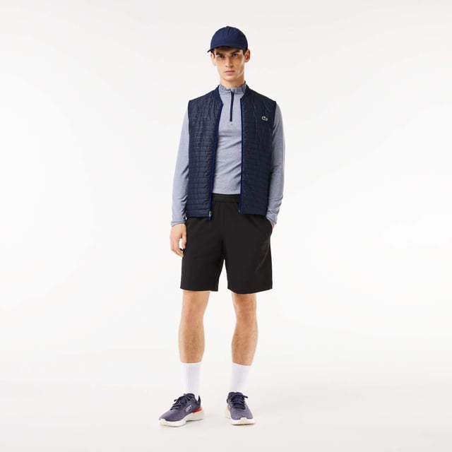 Designed for Tennis & Golf  for a regular frequency of use. This reversible padded sleeveless jacket is made with bonded quilting mixed with stretch taffetas on one side for an athletic silhouette and full bonded quilting for a more elegant look. This 3rd layer will keep you warm during your outdoor training. This product is providing you water repellent fabric which guarantees you to remain dry in bad weather conditions. Regular fit: natural ease on body It has been tested by professionals players to ensure functionality. The most adapted fashion sport apparel and accessories items to our Golf and Tennis athletes to prepare for and for game day.