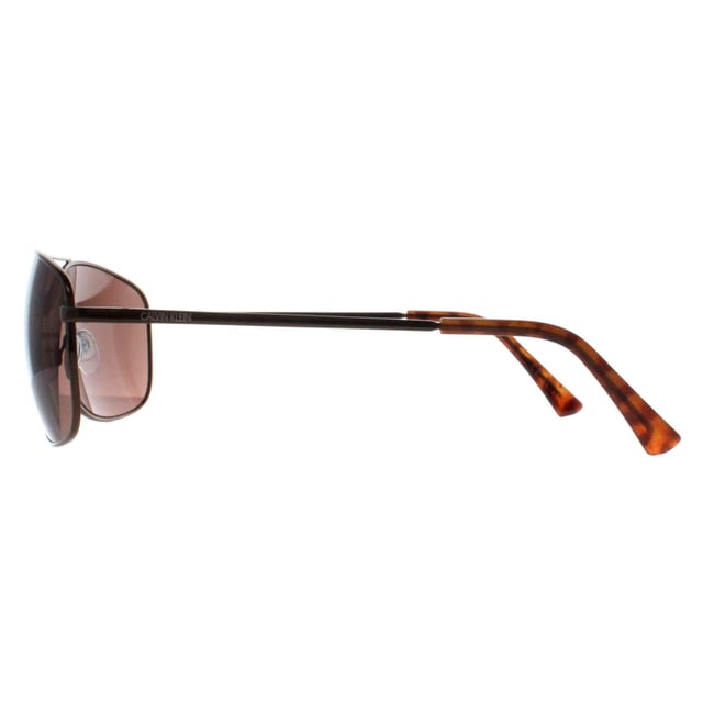 Calvin Klein Rectangle Mens Brown Brown CK19137S  Sunglasses are a sleek and stylish accessory that blend modern design with classic sophistication. Featuring a rectangle frame crafted from lightweight yet durable acetate, these sunglasses offer both comfort and durability for daily wear. The design is minimalist, with clean lines and subtle branding on the temples, making them a versatile option for any outfit. The lenses provide UV protection, ensuring eye safety while maintaining a chic, high-fashion look.