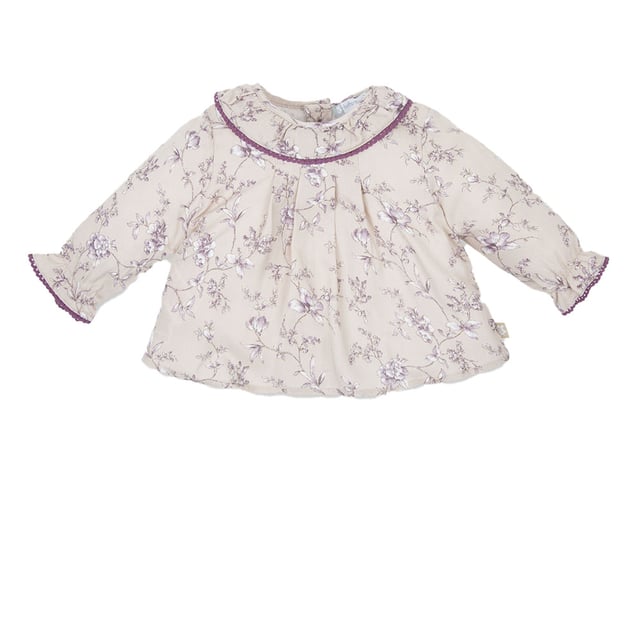 Girl's long sleeve blouse.
 Round lapel collar.
 Button closure at the back.
 Elastic and ruffled cuffs.
 Flared cut.
 Matching visible seams and floral print.
 Composition: 100% Viscose.
 Care:
Wash at a maximum temperature of 30ºC.
 Iron at medium temperature, max. 110ºC.
 It is not allowed to use a dryer.
 Do not use bleach.
 Does not support dry cleaning.