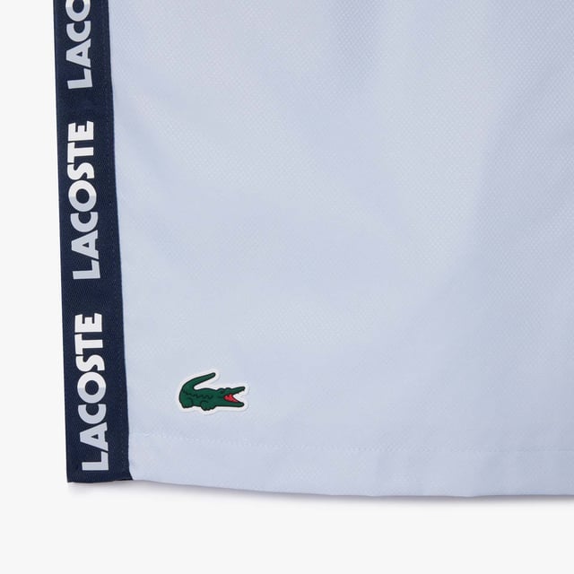 Mens Lacoste Sport Sportsuit Logo Stripe Tennis ShortsRecycled polyester made from manufacturing offcuts Regular fit  straight cut  Jersey lining Crease resistant Silicone crocodile on front