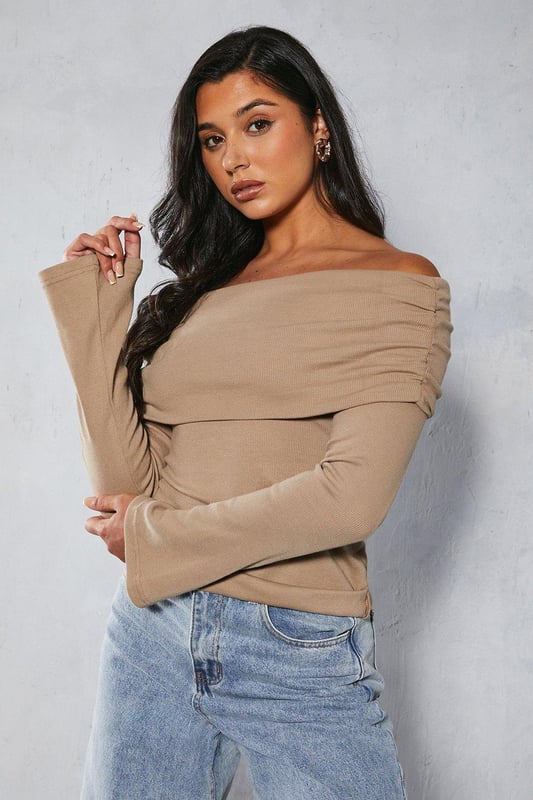 Bardot off-shoulder neckline
Long sleeves with ribbed texture  
Form-fitting stretch jersey fabric
Straight hem cut

This on-trend bardot top from Misspap features an alluring off-shoulder design with long sleeves. Crafted from a soft stretch jersey fabric with a body-hugging fit, it flatters the figure beautifully. The ribbed texture adds visual interest. Pair this versatile top with high-waisted jeans or a skirt for a chic day or night look. It works well layered under leather and denim jackets too. The fold-over bardot neckline is perfect for showcasing dainty necklaces. For a going-out look, style with heels and statement earrings to be the centre of attention. This top transitions seamlessly from casual daywear to evening cocktails.