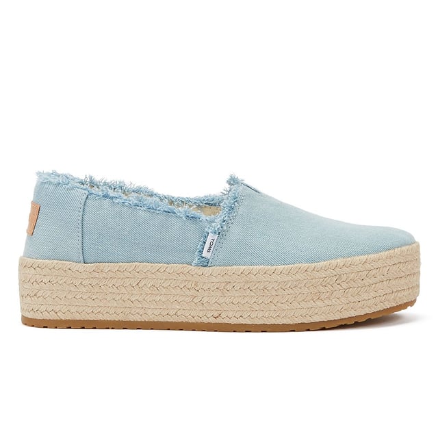 Elevate your style with these trendy espadrille platform slip-ons, featuring stylish textile uppers. The rope wrap platform adds a touch of sophistication to these shoes. Enjoy superior comfort with the padded heel that cushions your feet with every step. The OrthoLite Eco LT Hybrid insoles are made with 26% eco content, including 15% waste foam, 5% recycled materials, and 6% bio-oils, ensuring both comfort and sustainability. The rubber outsole offers excellent grip and durability. With an outsole height of approximately 1.5 inches, these slip-ons provide the perfect amount of elevation. Rest assured, these shoes are completely vegan, catering to your ethical choices. Step out in style and comfort with our exceptional espadrille platform slip-ons.