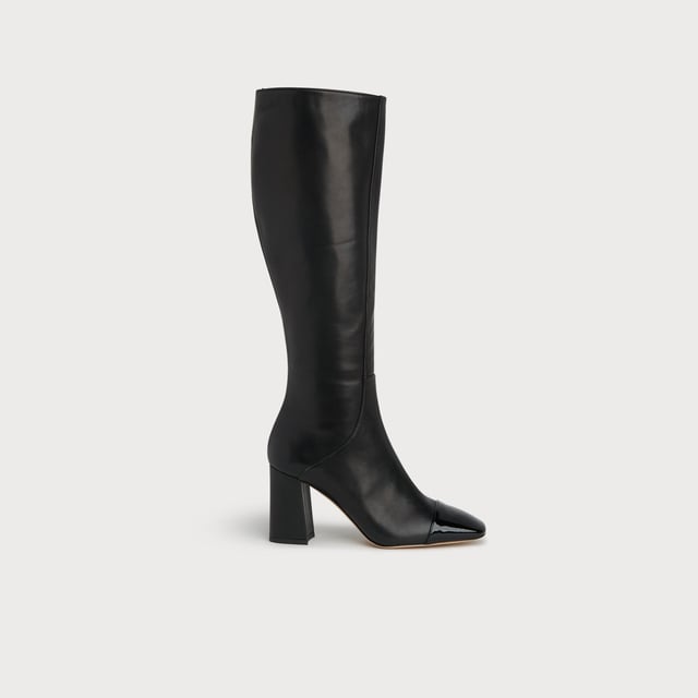 LK Bennett Bess Knee Boots, Black A classic knee boot with a difference, our Bess boots take on the season's toe cap trend. Crafted in Italy from beautifully-soft black calf leather, they have a square toe with a black patent toe cap, seam detail to the front, an inside zip and a leather-covered squared block heel. They're perfect with Sixties-inspired mini dresses and Seventies-style midi dresses.