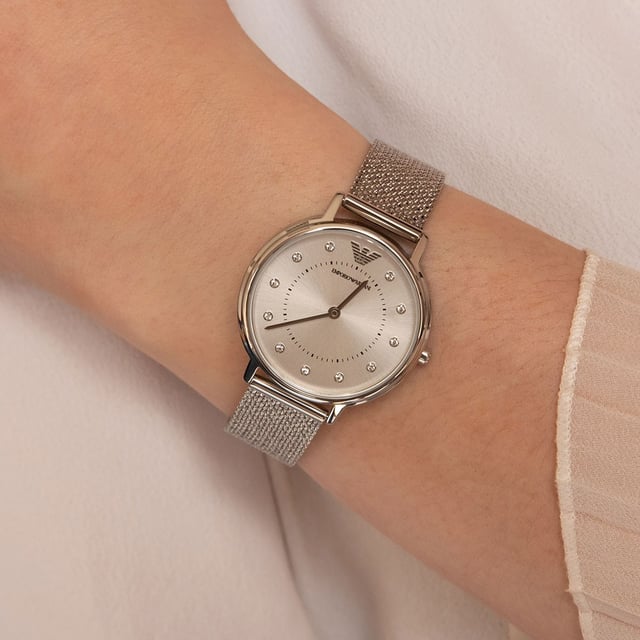This Emporio Armani Kappa Analogue Watch for Women is the perfect timepiece to wear or to gift. It's Silver 30 mm Round case combined with the comfortable Silver Stainless steel watch band will ensure you enjoy this stunning timepiece without any compromise. Operated by a high quality Quartz movement and water resistant to 3 bars, your watch will keep ticking. This fashionable and classic watch matches any outfit at any occasion,it adds style to your life High quality 19 cm length and 14 mm width Silver Stainless steel strap with a Fold over clasp Case diameter: 30 mm,case thickness: 6 mm, case colour: Silver and dial colour: Silver