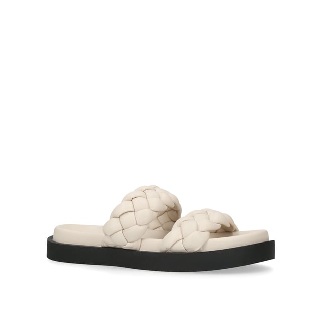 Slip into the KG Kurt Geiger Rath sandal this season. This bone sandal features two braided effect straps securing the foot above the curved footbed. The stepped sole is in a black flatform style.