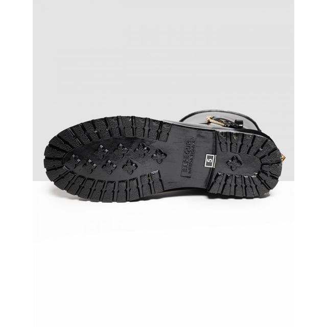 Botas mugello negras Barbour International para mujer, fabricadas en caucho y suela de caucho. Presentan: acabado de alto brillo, suela de perfil bajo, marca Barbour, hebilla decorativa y estilo motero.