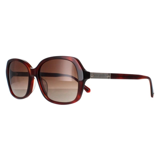 Kate Spade Buttefly Womens Havana Brown Gradient Polarized Yvette/S S Sunglasses heeft een chique vlindermontuur van hoogwaardig acetaat, dat zowel duurzaamheid als lichtgewicht comfort biedt. De lenzen bieden uitstekende UV-bescherming, zodat je ogen beschermd zijn tegen schadelijke zonnestralen terwijl je helder zicht behoudt. De poten zijn versierd met het iconische Kate Spade-logo, voor een vleugje luxe en verfijning.